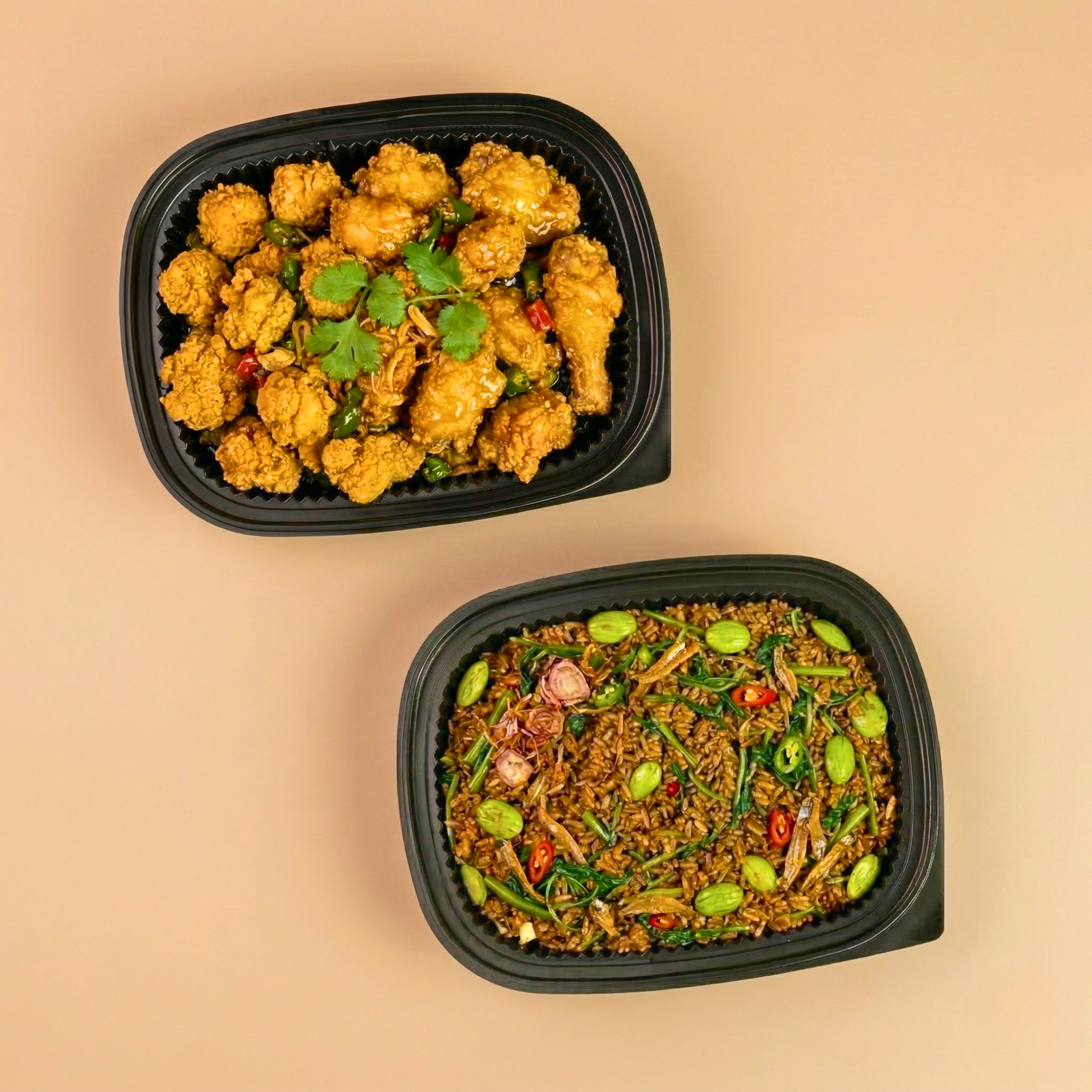 Crispy spiced chicken served alongside aromatic kampung nasi goreng.