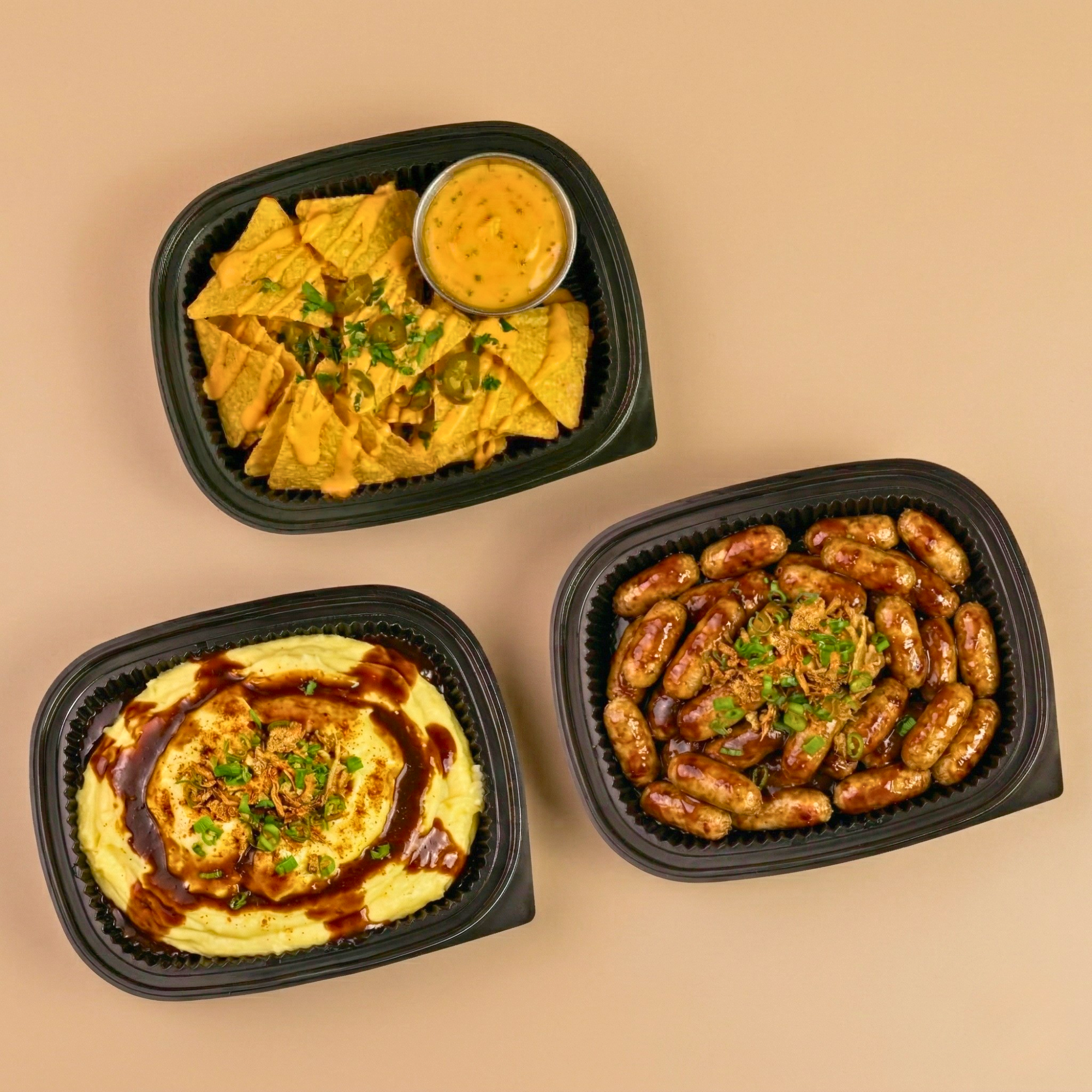 A hearty trio of creamy mashed potatoes with demi-glace, hickory cheese nachos, and chicken chipolata with hickory mayo.